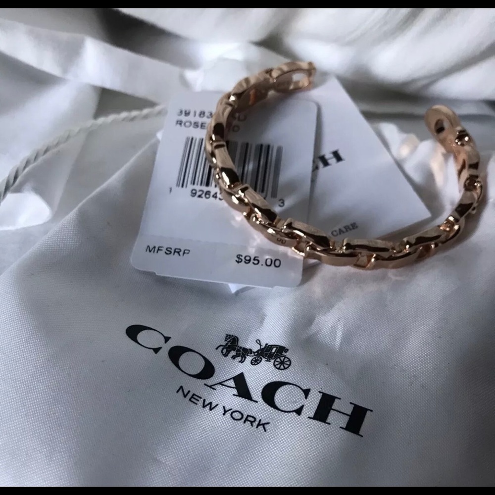 NWT Coach cuff link bracelet in  rose gold tone.